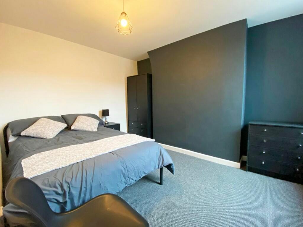 A spacious and inviting double bedroom, perfect...
