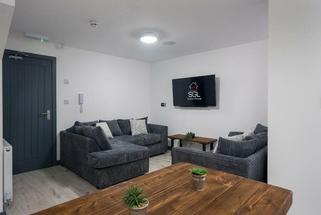 A spacious and modern living room perfect for s...