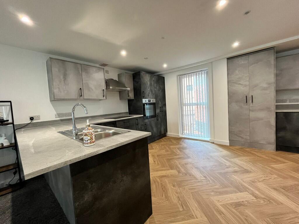 A modern and stylish kitchen with ample space a...