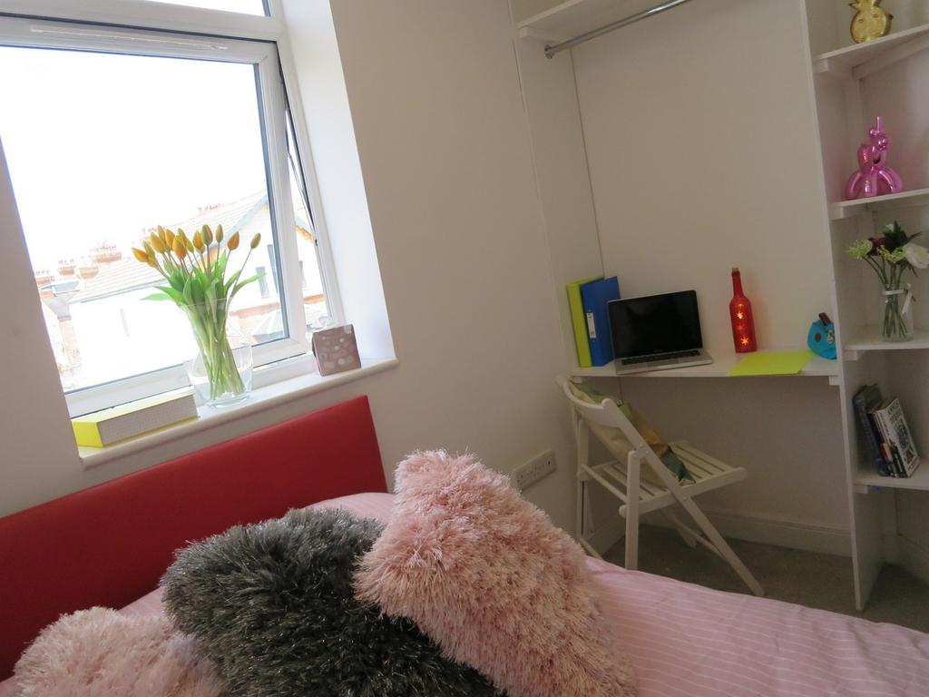 A bright and inviting double bedroom featuring ...