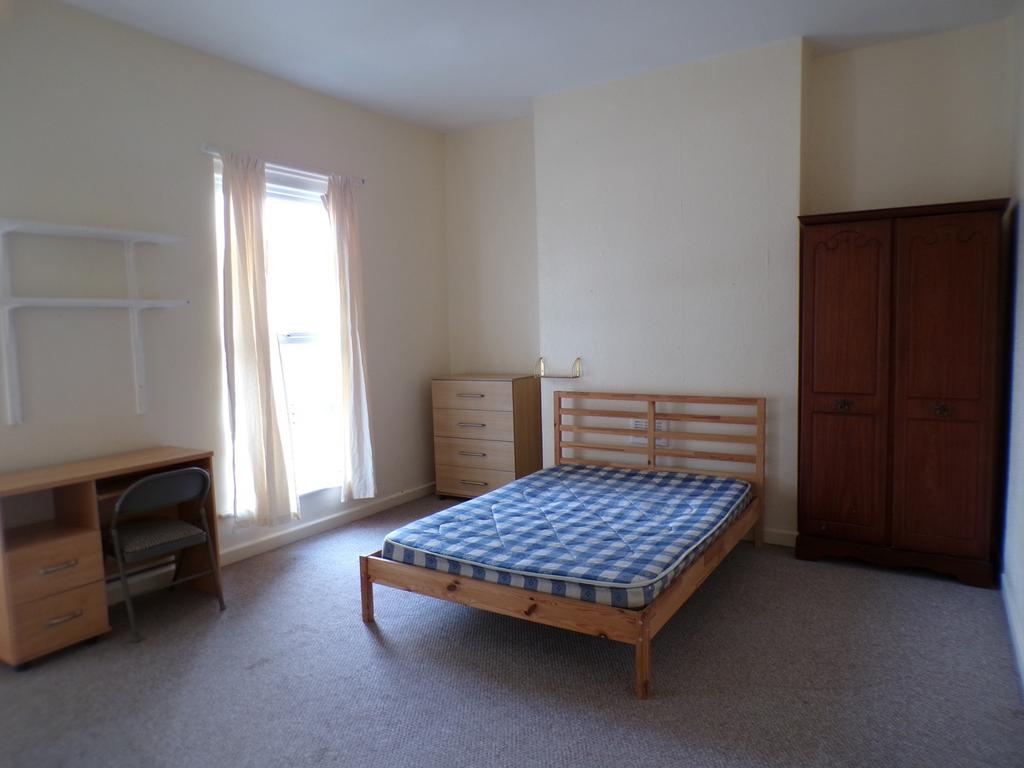 A bright and spacious double bedroom with ample...