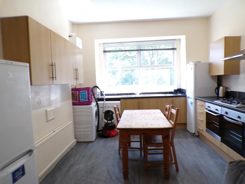 A bright and spacious kitchen with ample storag...