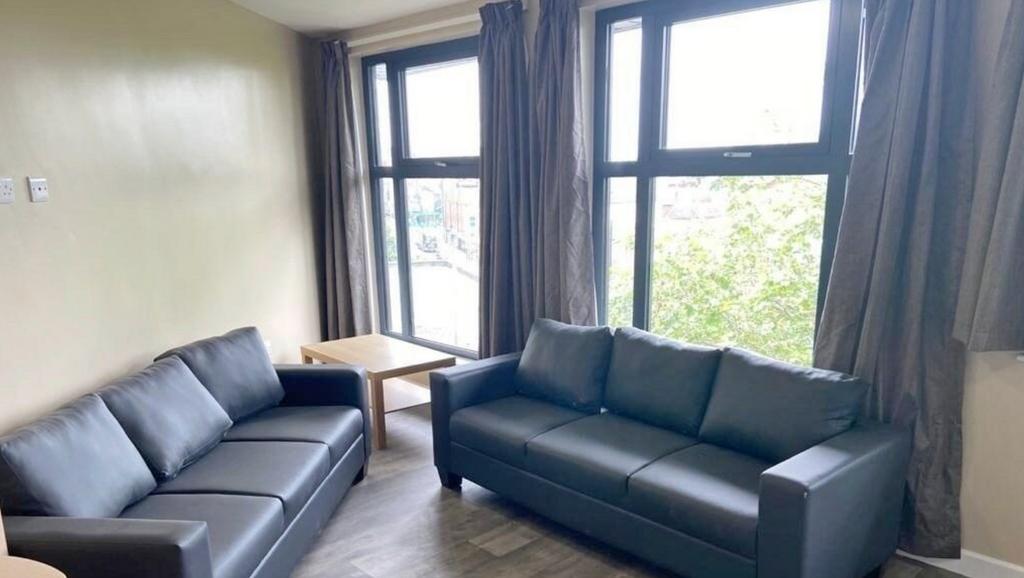A bright and spacious living room, featuring la...