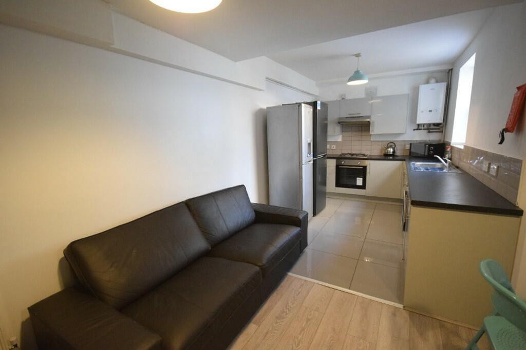 A modern and inviting kitchenette with ample sp...