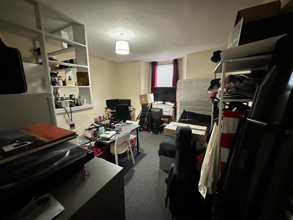 A cozy living room with potential for social ga...