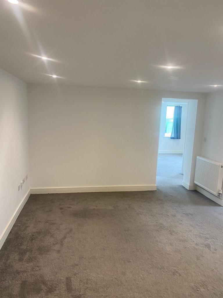 A spacious and inviting large modern living roo...