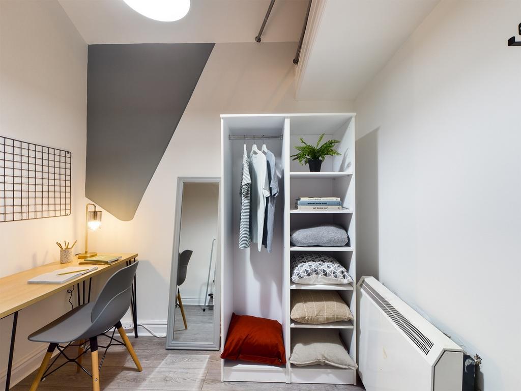 A tidy small storage area featuring a stylish w...