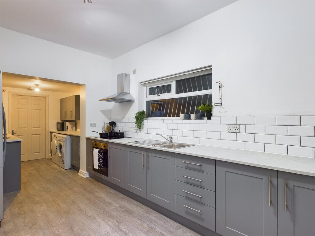 A modern and spacious kitchen with plenty of na...
