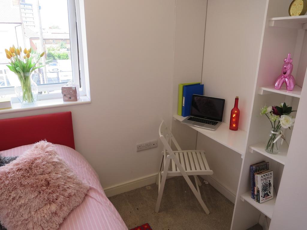 A bright and inviting double bedroom featuring ...