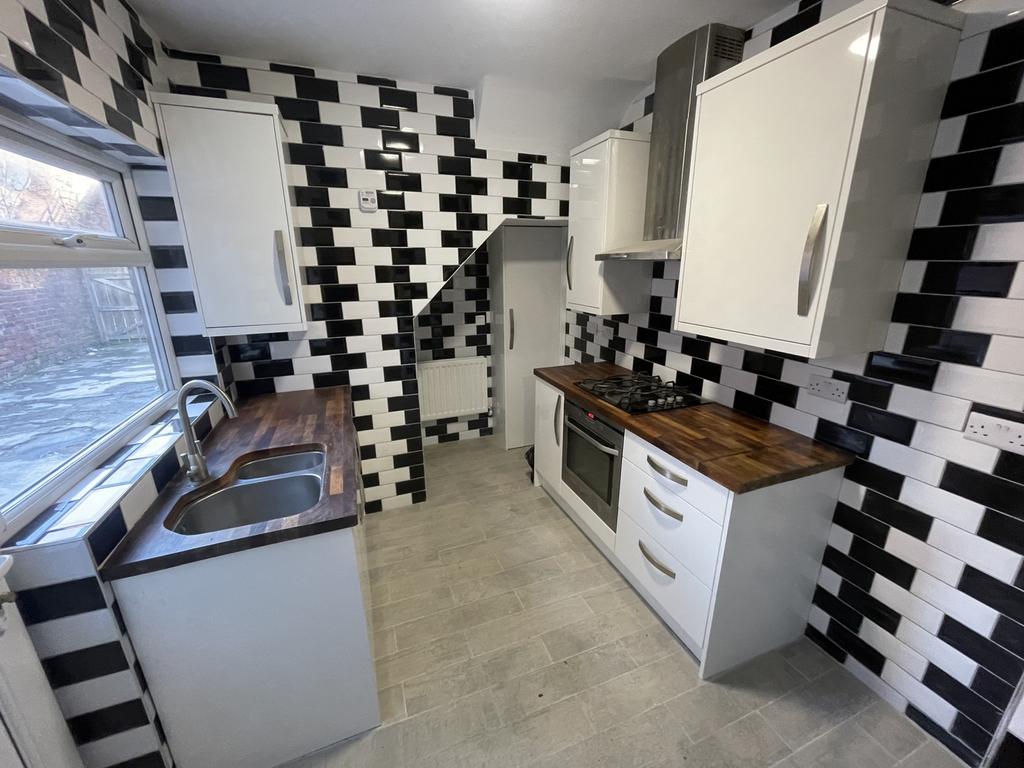 A modern and stylish kitchen with a unique blac...