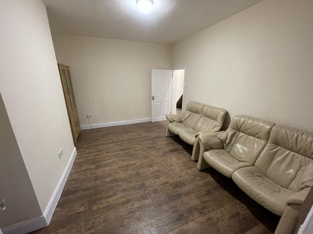 A spacious and inviting living room featuring c...