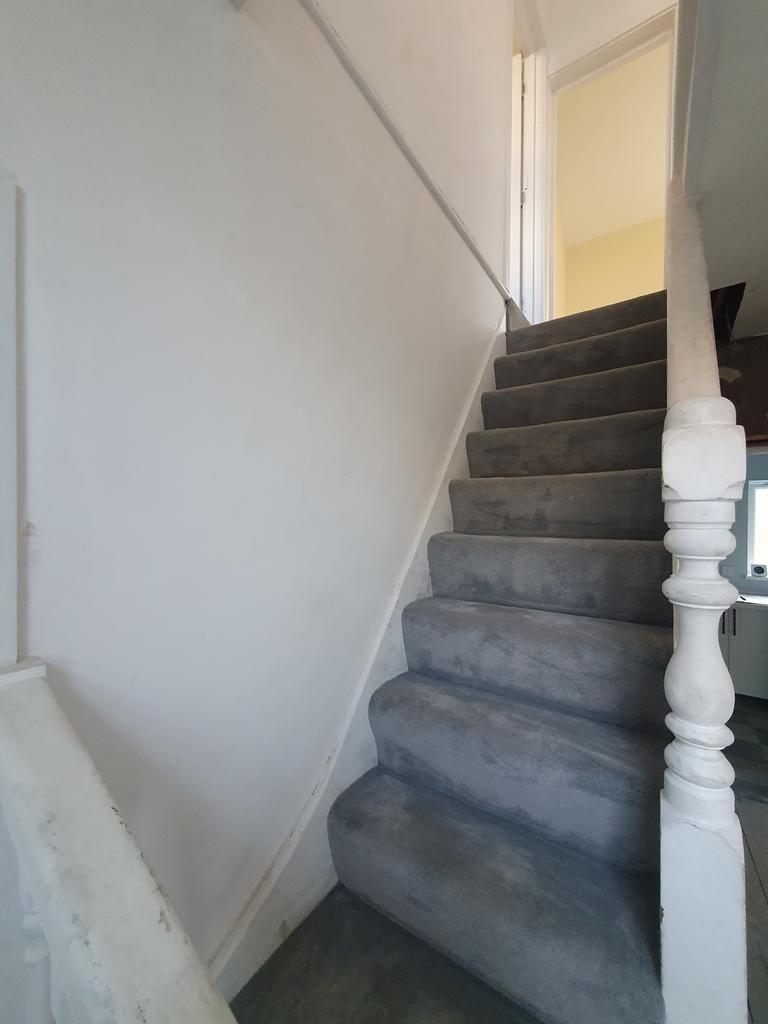 A staircase with a clean and tidy appearance, l...