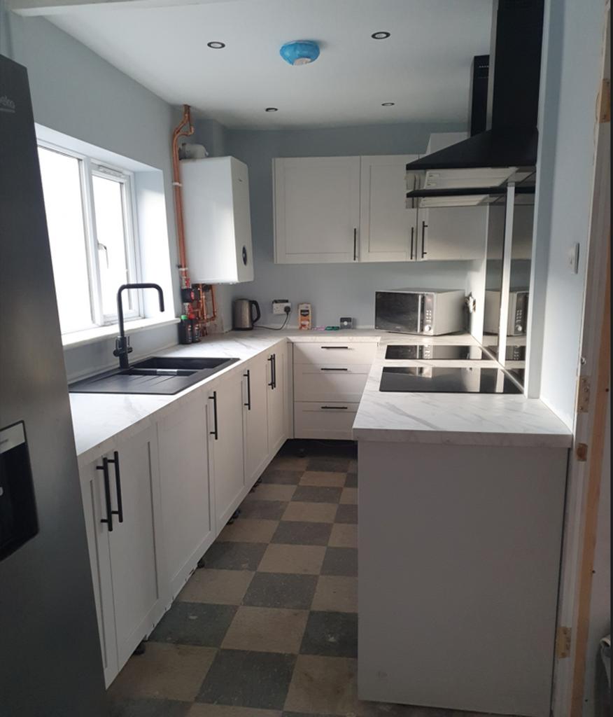 A modern and well-maintained kitchenette featur...