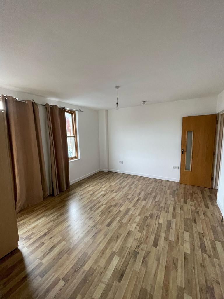 Spacious and inviting living room featuring lar...