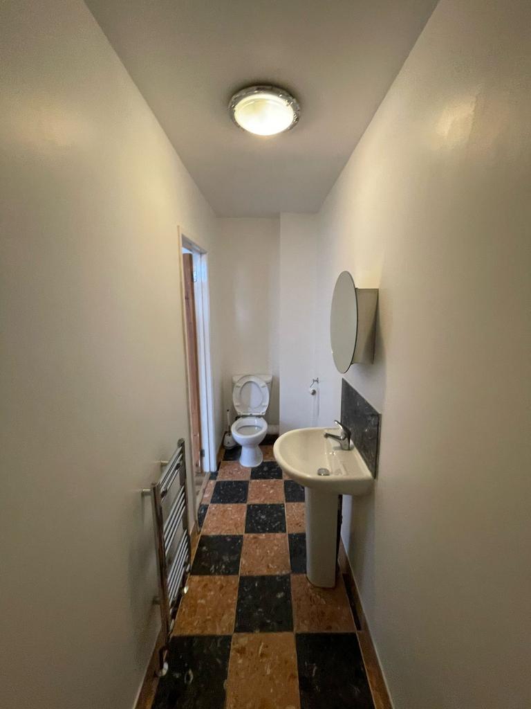 A well-maintained bathroom featuring modern fix...