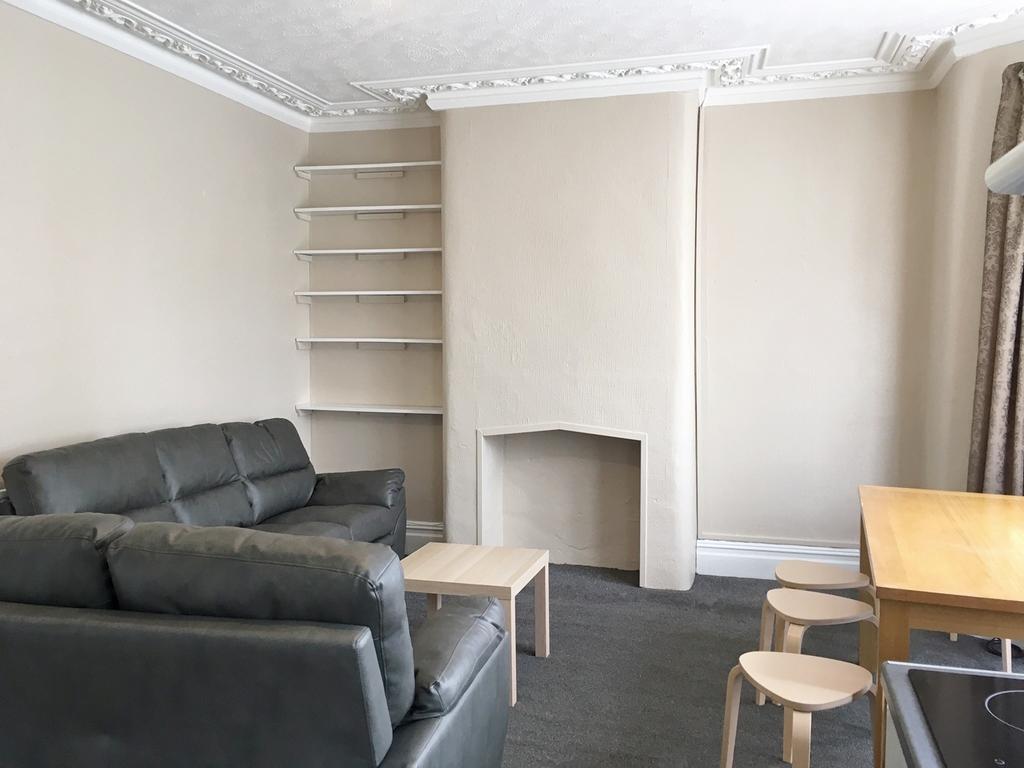 This contemporary living room offers a cozy and...