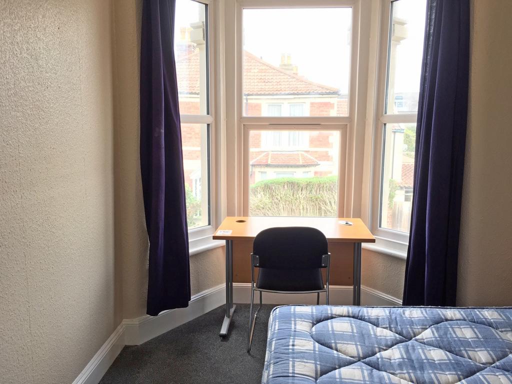 Bright and cozy double bedroom featuring large ...