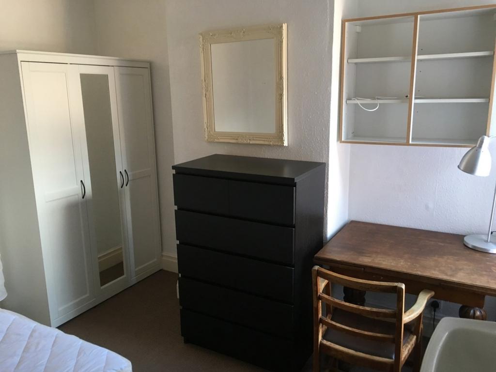 Bright and inviting double bedroom featuring am...