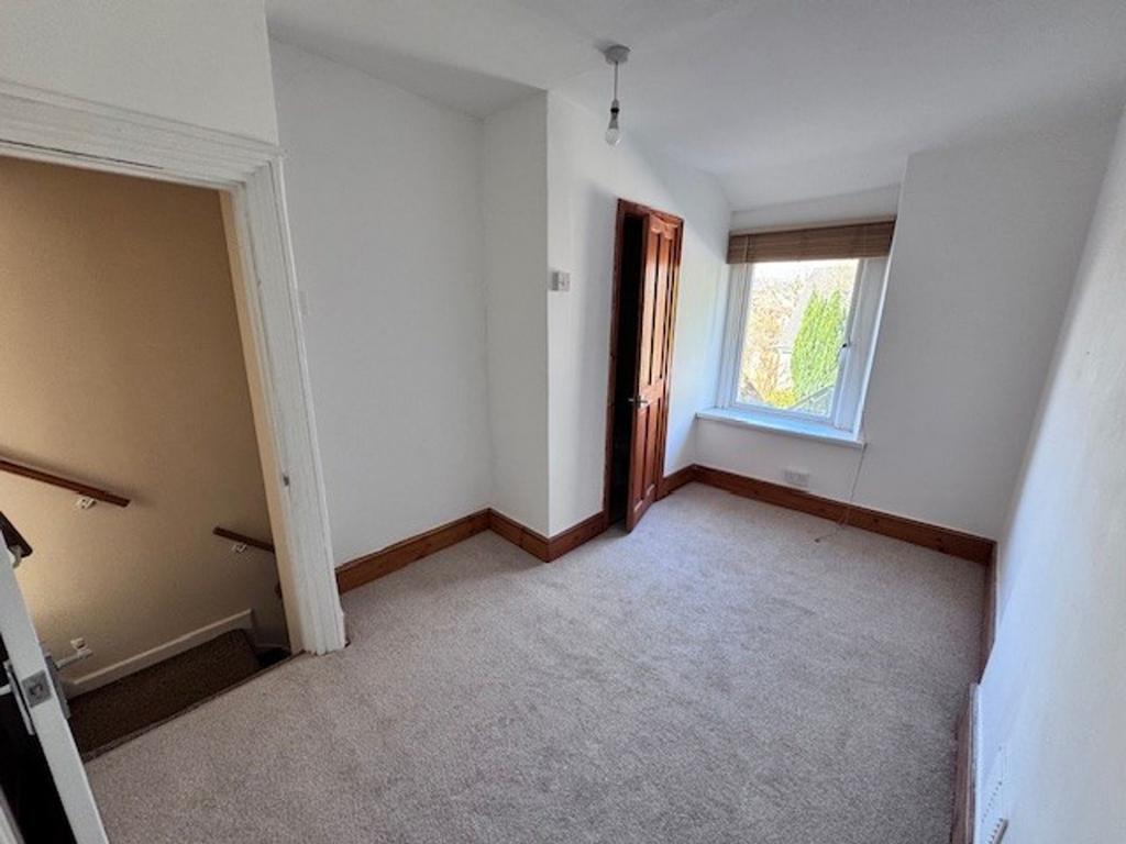 Bedroom with bathroom accessed via wooden door