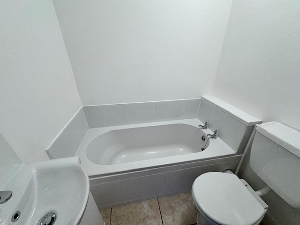 Bedroom with bathroom accessed via wooden door