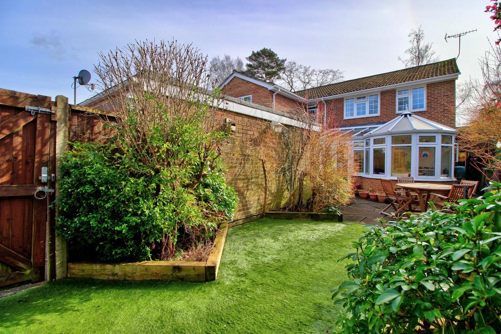 Enclosed garden with side gate to driveway