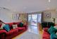 Double doors open to conservatory