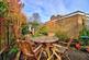 Patio showing rear of detached garage