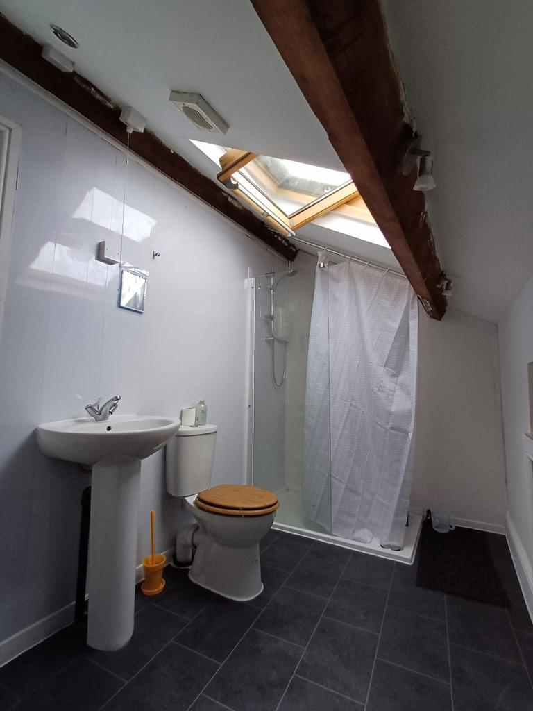 Bright and modern bathroom featuring a sleek sh...