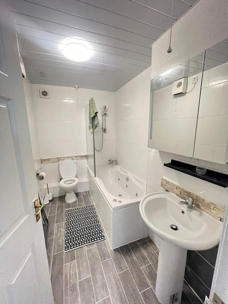 A beautifully designed bathroom suite featuring...