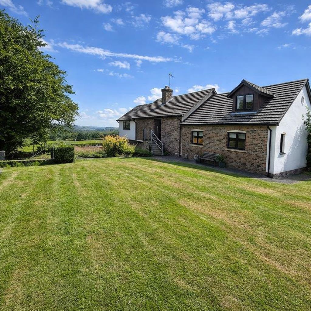 Country bungalow with vibrant lawn.png