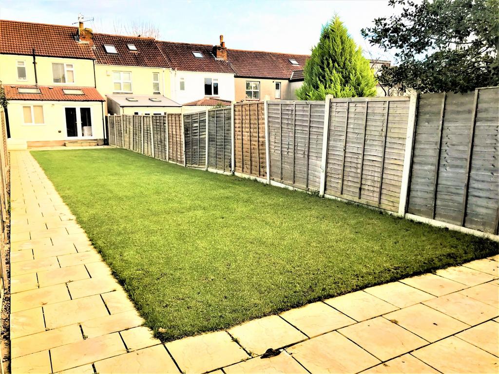A spacious garden featuring a well-maintained l...