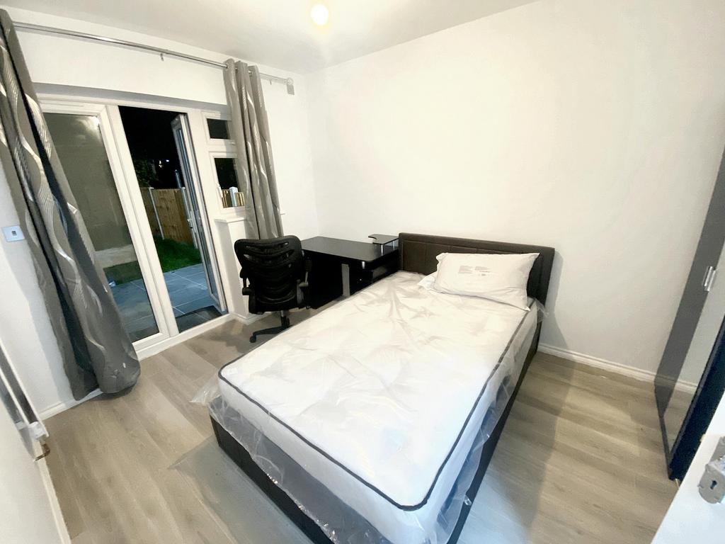A bright and inviting double bedroom featuring ...
