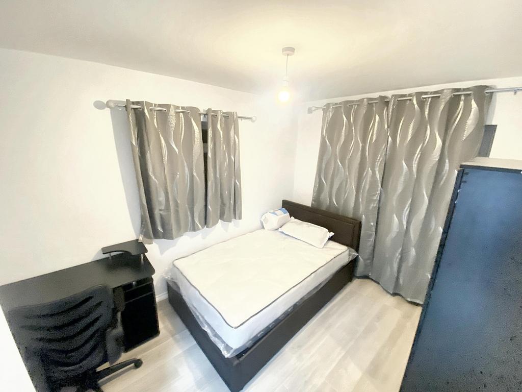 Cozy double bedroom featuring modern decor, amp...