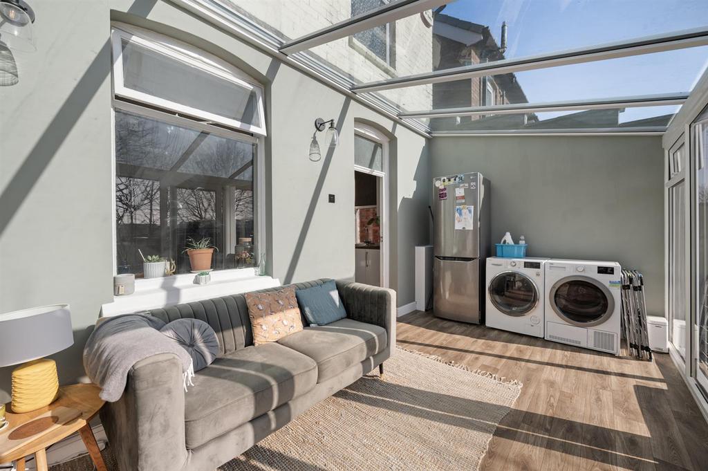 Sun Room - seating and utility area.jpg
