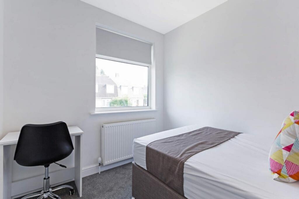 Bright and cozy double bedroom featuring a comf...
