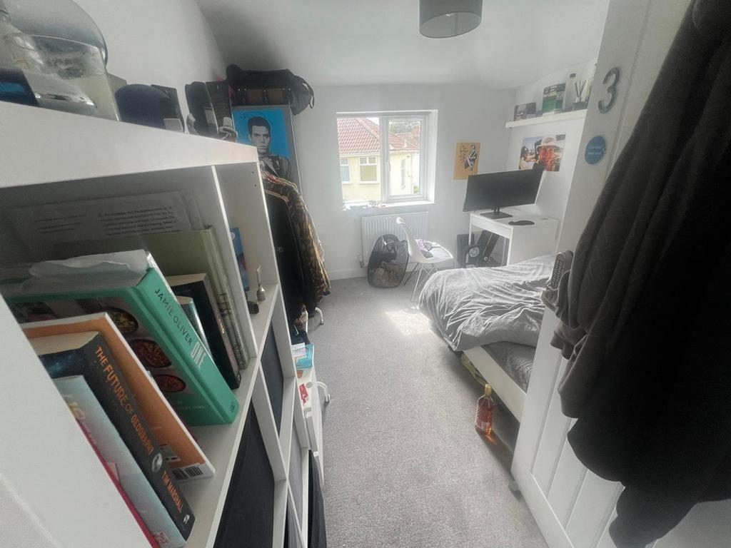 A cozy and well-organized double bedroom with g...