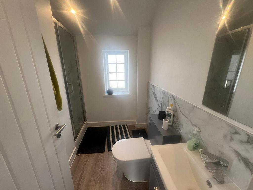 A modern and spotless bathroom featuring elegan...
