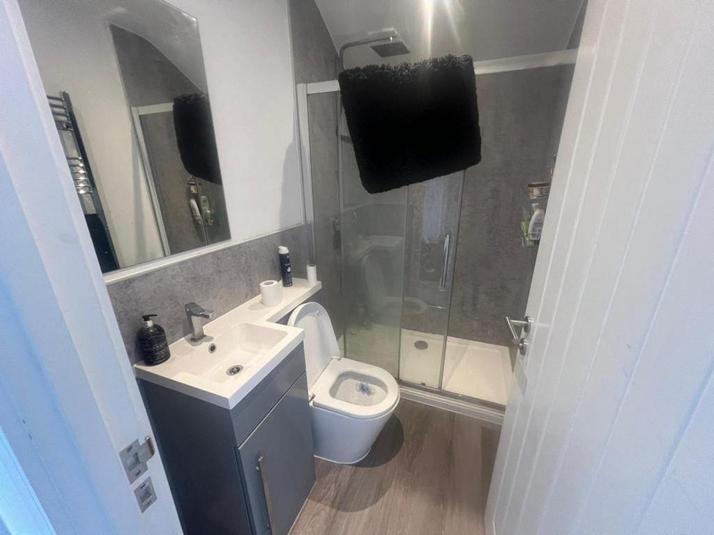 A modern and clean bathroom featuring a sleek d...