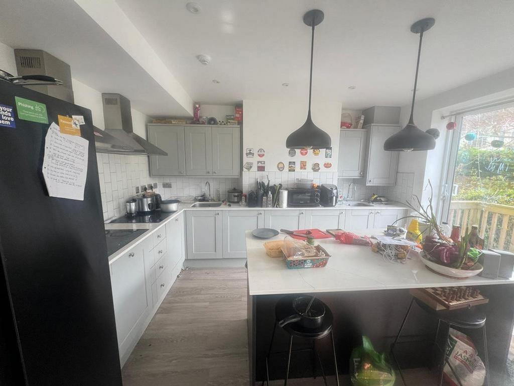 A bright and spacious kitchen featuring modern ...