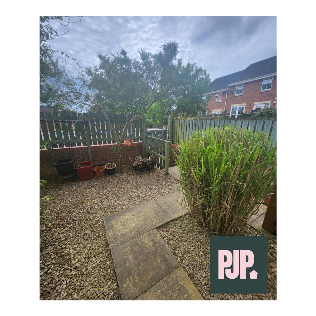A charming garden space with well-maintained pe...