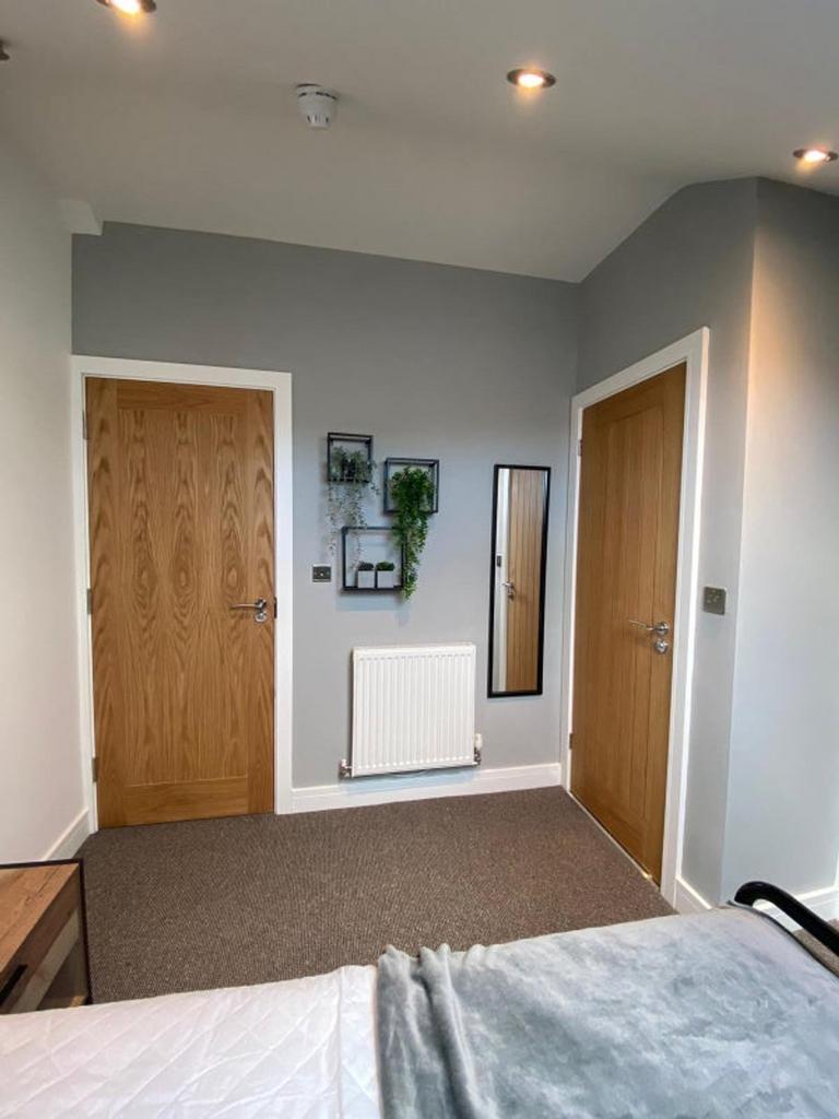 This inviting double bedroom features a cozy la...