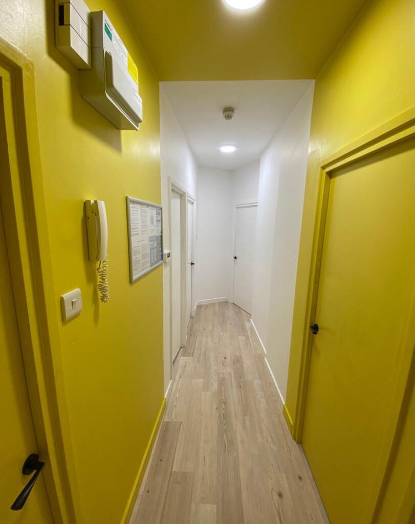 Bright and inviting hallway featuring modern de...