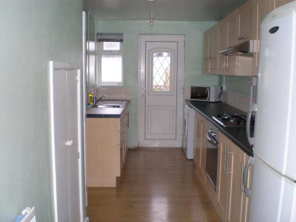 A well-equipped kitchen featuring modern cabine...