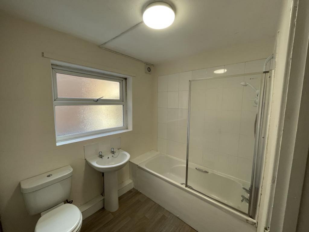 A well-maintained bathroom featuring a modern s...