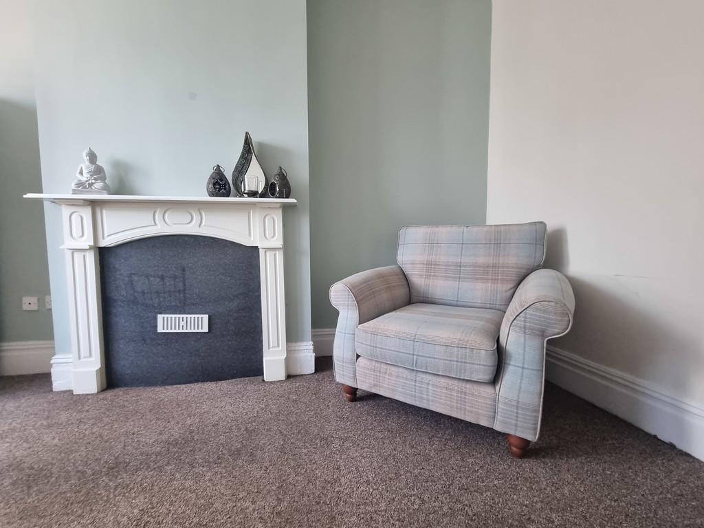 Fireplace and armchair