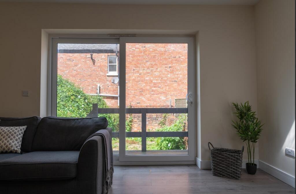 Bright and inviting living room with large wind...