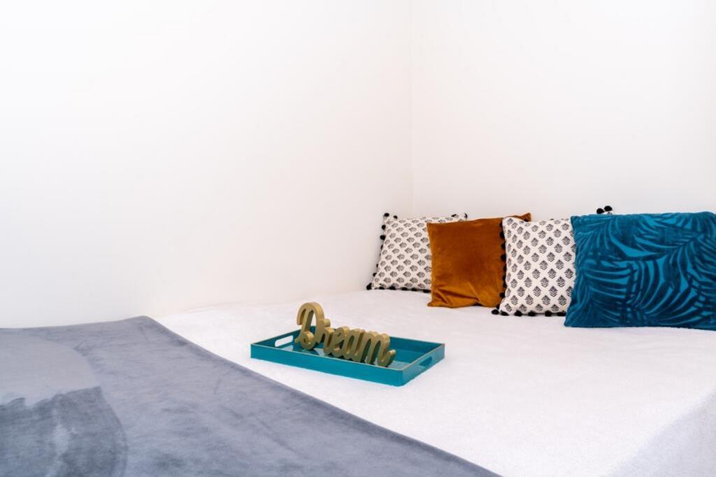 A cozy double bedroom featuring a stylish desig...