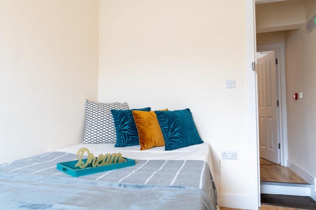 This inviting double bedroom features a cozy la...