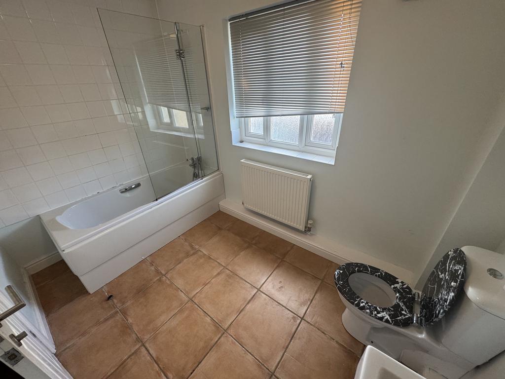 En suite bathroom to bedroom 1
