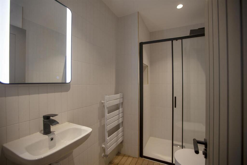 A modern bathroom featuring a sleek design with...